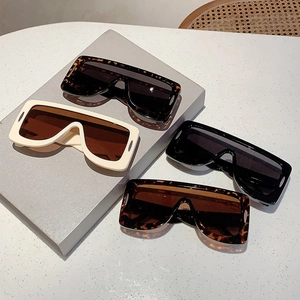 Futuristic oversized square sunglasses in leopard, cream, and black color options