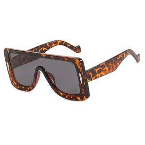 Oversized tortoise frame sunglasses with dark grey lenses in futuristic square design