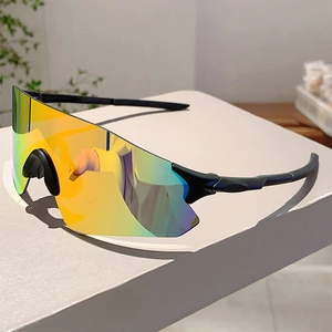 Detail view of colorful gradient lenses on sleek black wraparound sport sunglasses