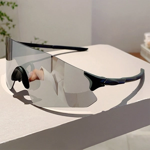 Macro view of silver mirror lens and aerodynamic black frame on sports sunglasses