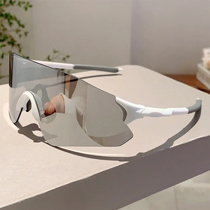 Close-up of modern sports sunglasses with white frame and silver anti-glare shield lens