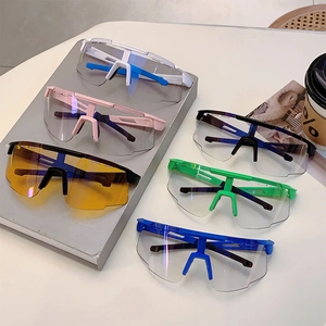 Outdoor cycling sunglasses detail showcasing six colorful frames on a display table