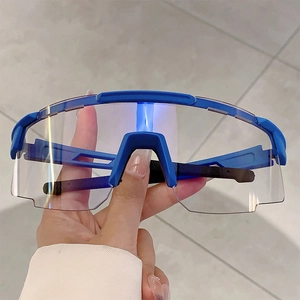 Detailed view of lightweight blue sport cycling glasses with clear panoramic lenses
