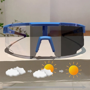 Blue photochromic sports sunglasses showing lens tint transition for outdoor cycling