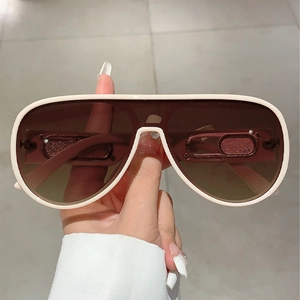 White aviator sunglasses with brown gradient lenses and modern thick frames