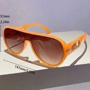 Detail view of orange aviator sunglasses with dimensions 141mm width and 57mm height