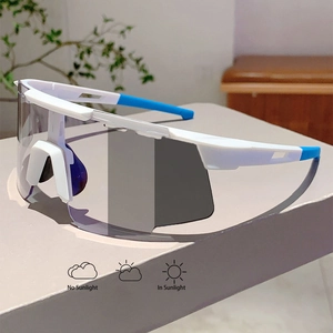 Photochromic sports sunglasses showing lens color change from clear to dark tint