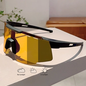 Detail of photochromic cycling sunglasses showing lens color change in sun and shade