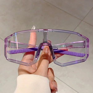 Close-up of purple cycling glasses with non-slip honeycomb texture on temple tips