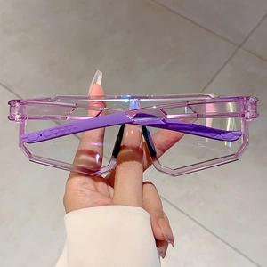 Detail of purple transparent geometric frame sunglasses with anti-slip textured temples