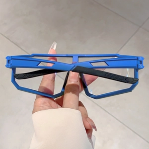 Detail of blue geometric frames with black hexagonal anti-slip texture on temple arms