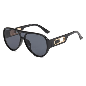 Classic black pilot sunglasses with oversized frames and gold oval hollow temple details