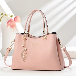 Pink large capacity faux leather handbag with golden leaf pendant and pearl charm