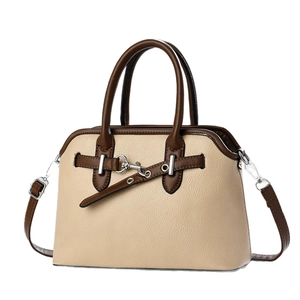 Minimalist beige shell bag with contrast brown straps and lychee grain leather texture