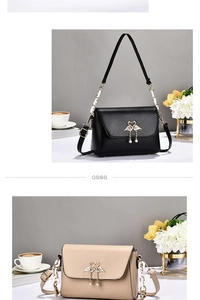 Detail of elegant flap shoulder bags in black and beige with swan heart buckle
