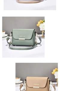 Detailed view of fashion shoulder bags in green and khaki with gold metal bar accents