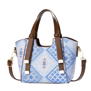 Sac bandoulière bohème bleu avec poignées en cuir marron et bandoulière réglable