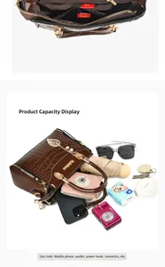 Detail of brown crocodile pattern handbag interior with main compartment and zipper pocket