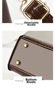 Detail of detachable gold clasp and bottom protective studs on brown crocodile tote