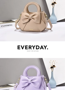 Detail view of khaki and lavender handbags with large bow knots and gold hardware