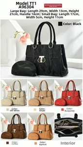 Detail view of large textured tote bag set with metal twist lock and small clutch purse