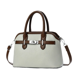 Minimalist cream shell bag with dark brown handles and silver metal rotary lock buckle