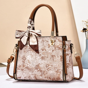 Vintage embroidered tapestry handbag with leather straps and decorative silk scarf detail