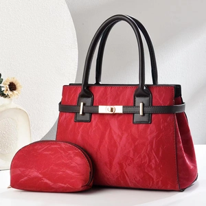 Elegant red vintage tote bag and matching pouch set with golden metal clasp and black handles