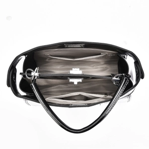 Top view of spacious interior with herringbone lining and zippered compartments in black tote