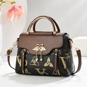 Retro brown monogram crossbody handbag with luxury gold swan clasp and pearl detail