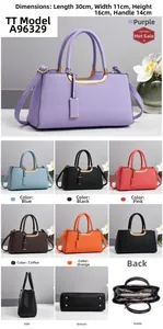 Vues détaillées du sac en cuir grainé avec dimensions 30x11x16cm et poignée en métal