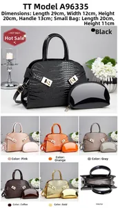 Detail view of large tote and small pouch set featuring embossed faux crocodile texture