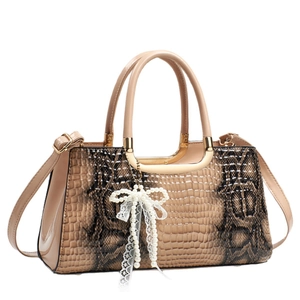 Chic beige crocodile texture handbag with pearl bow pendant and gold hardware details