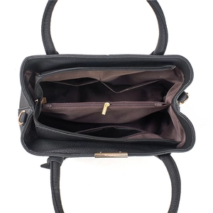 Interior view of large capacity shoulder bag showing multi-compartment storage and brown lining