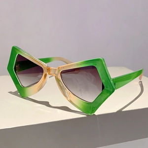 Detail of green and yellow gradient oversized butterfly sunglasses with metal hinges