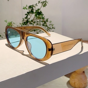 Detail view of model ZN5105 oversized amber sunglasses with blue tinted lenses