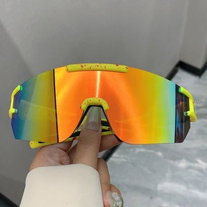 Detail of yellow cycling sunglasses with red splatters and multi-color polarized lens