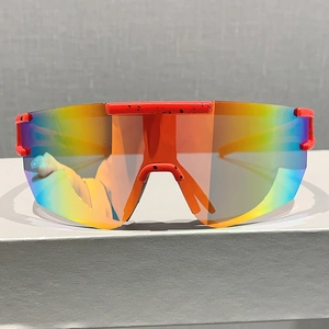 Detail view of colorful mirrored cycling glasses with orange black speckled large frame