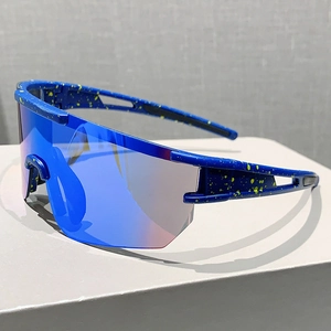 Detail of cycling glasses with yellow splatter blue frame and large colorful lens