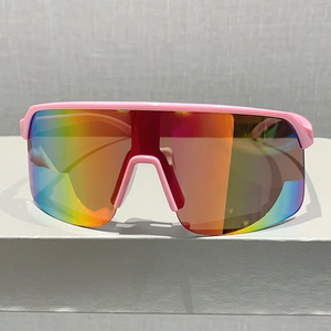Front view of large sport sunglasses with matte pink frame and colorful gradient lens