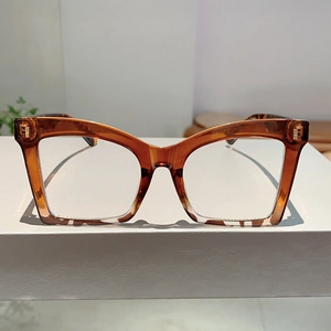 Detail of oversized butterfly brown eyewear frame with elegant metal rivets on the corners