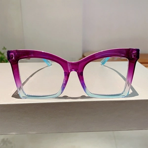 Close-up of butterfly frame glasses with purple to blue gradient and transparent finish