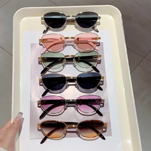 Multiple vintage wood grain sunglasses in six trendy colors displayed on a cream tray