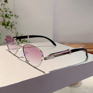 Detailed side view of silver metal sunglasses with purple gradient lenses and black temples