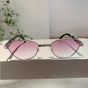 Detail of purple gradient lenses and silver metal frame with fine engraved bridge and hinge
