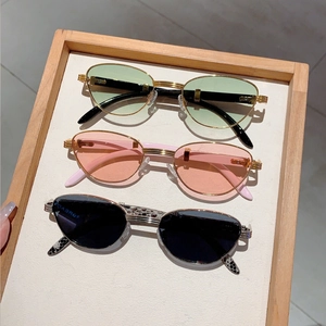 Retro oval sunglasses set with metal frames and wood grain texture in multiple colors