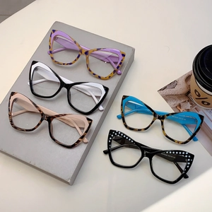 Retro oversized cat-eye blue light blocking glasses in various tortoiseshell and contrast colors