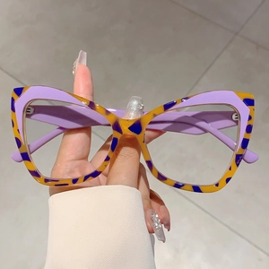 Retro oversized cat-eye glasses with purple and yellow leopard print contrast frames