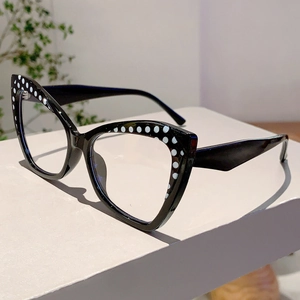 Detail of vintage cat-eye glasses frame in black with decorative white polka dots