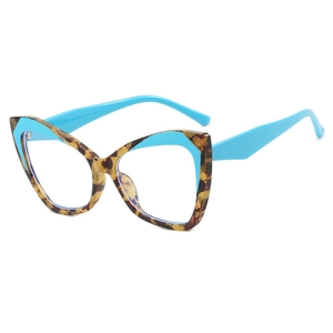 Modern cat-eye oversized glasses with tortoiseshell outer frame and bright blue inner rim